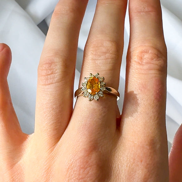 Orange Sapphire and Diamond Halo Ring